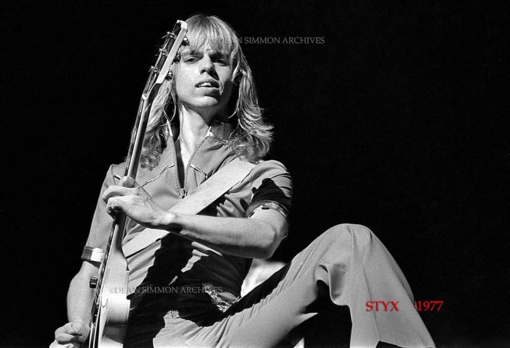 THE GREAT TOMMY SHAW, STARES DOWN THE CAMERA AT CHICAGO'S AUDITORIUM THEATRE DURING 'STYX'S 1977 WORLD TOUR FOR THE ALBUM "GRAND ILLUSION".